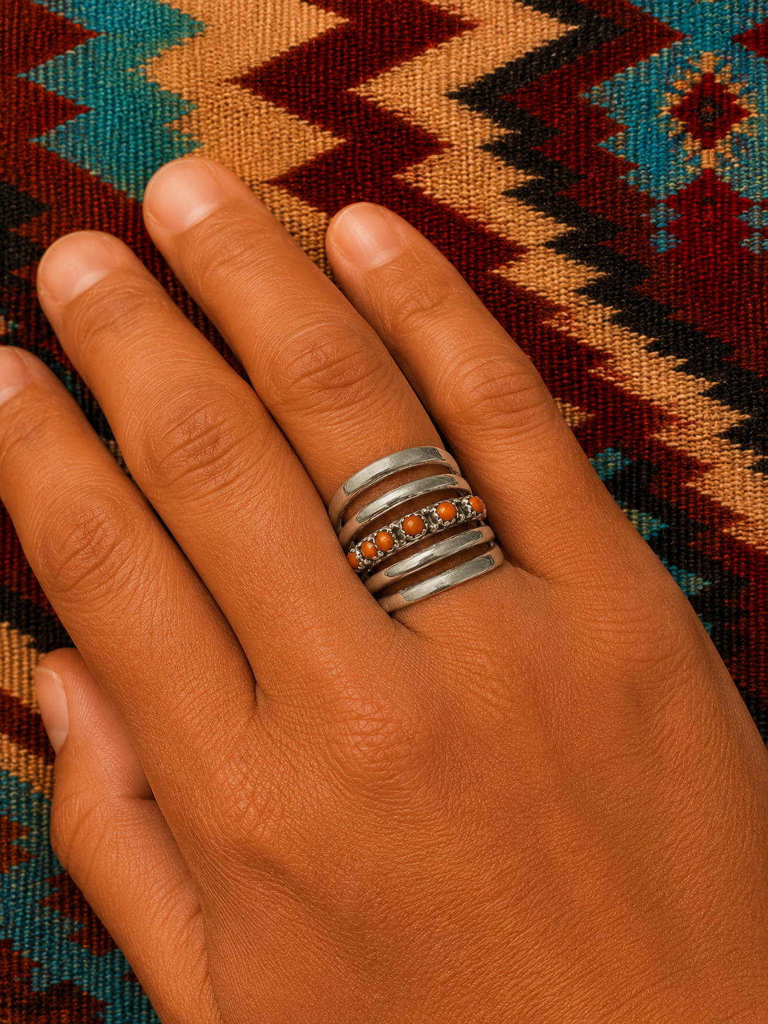 Ladies sterling silver cast ring with coral stones